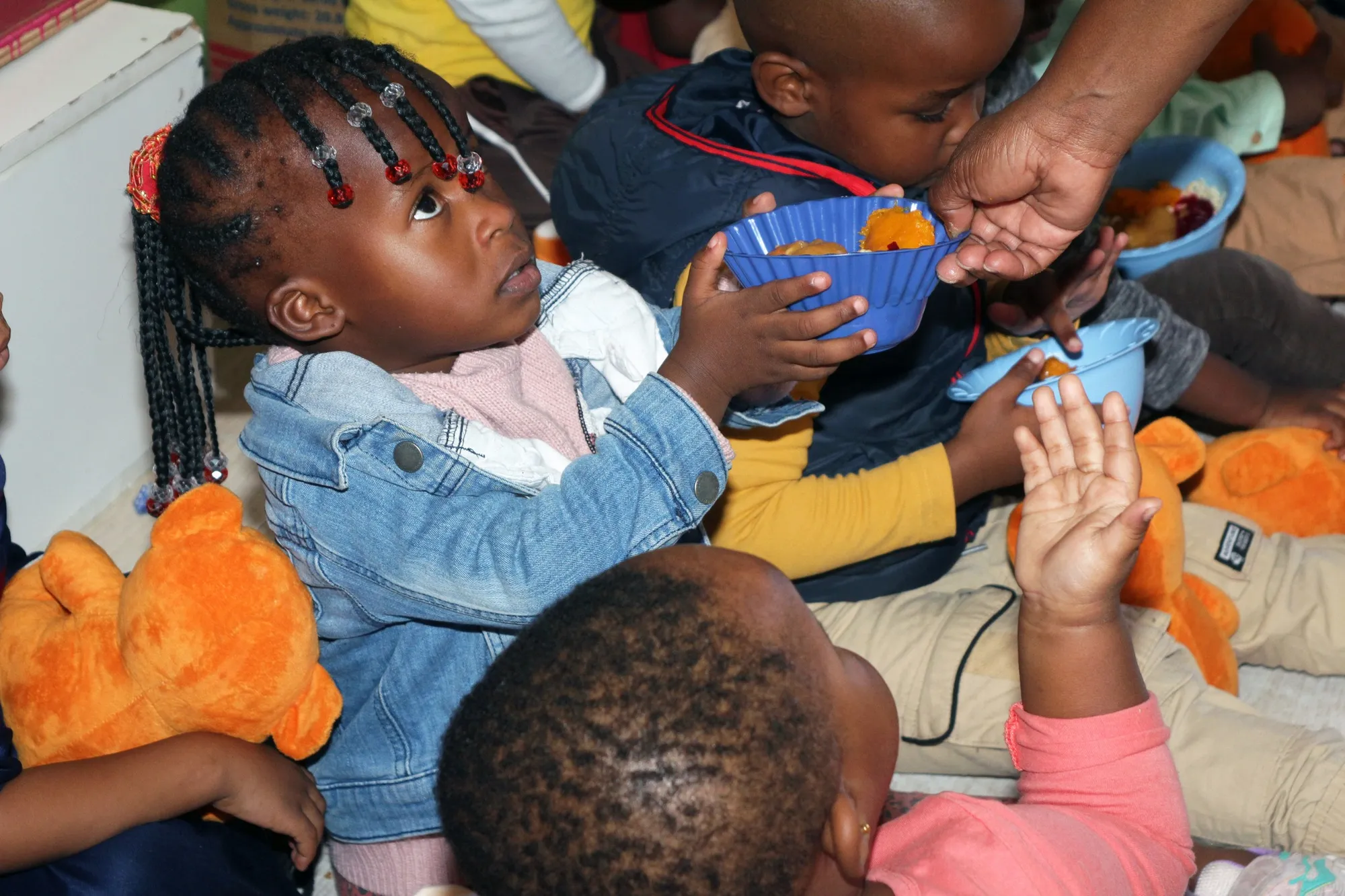 a young lady being handed sweets - ignition cares &amp; ladies love 