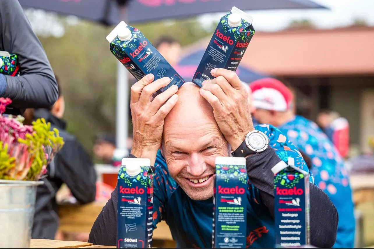 man holding up boxed water